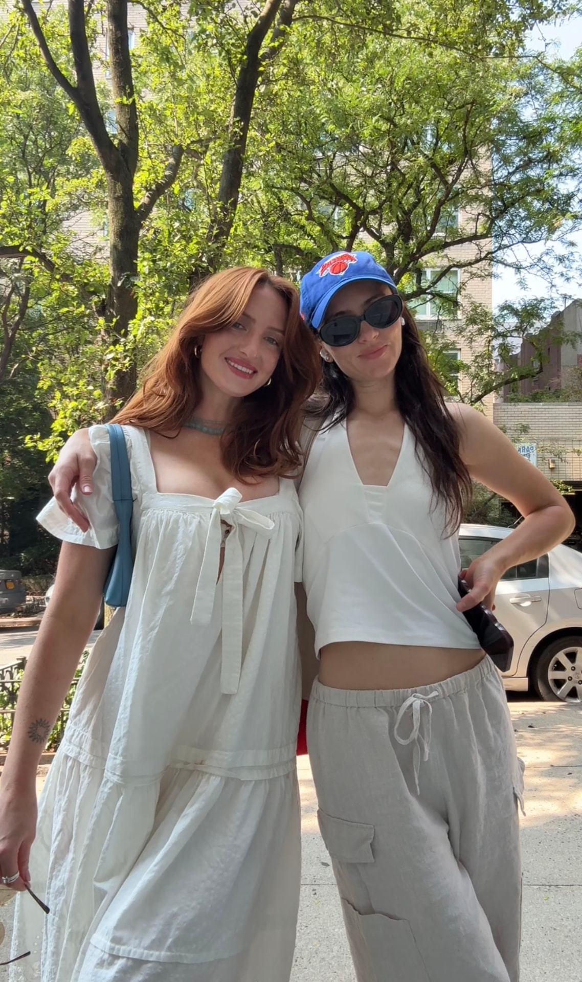 Lara and Skylar Dykstra on a tree lined street between calls